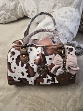 Juicy Couture Brown and White Cow Print Satchel with Pink Bow Charm